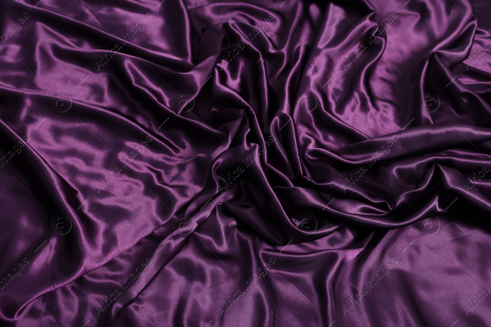 Luxury purple silk bed linens as background, top view Photo of Luxury purple silk bed linens as background, top view