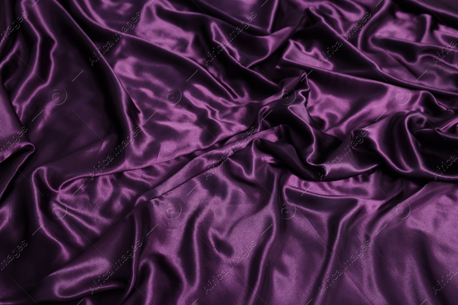 Luxury purple silk bed linens as background, above view Photo of Luxury purple silk bed linens as background, above view