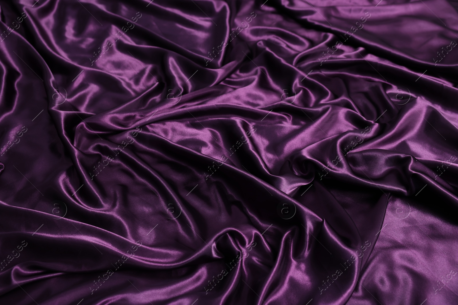 Luxury purple silk bed linens as background, above view Photo of Luxury purple silk bed linens as background, above view