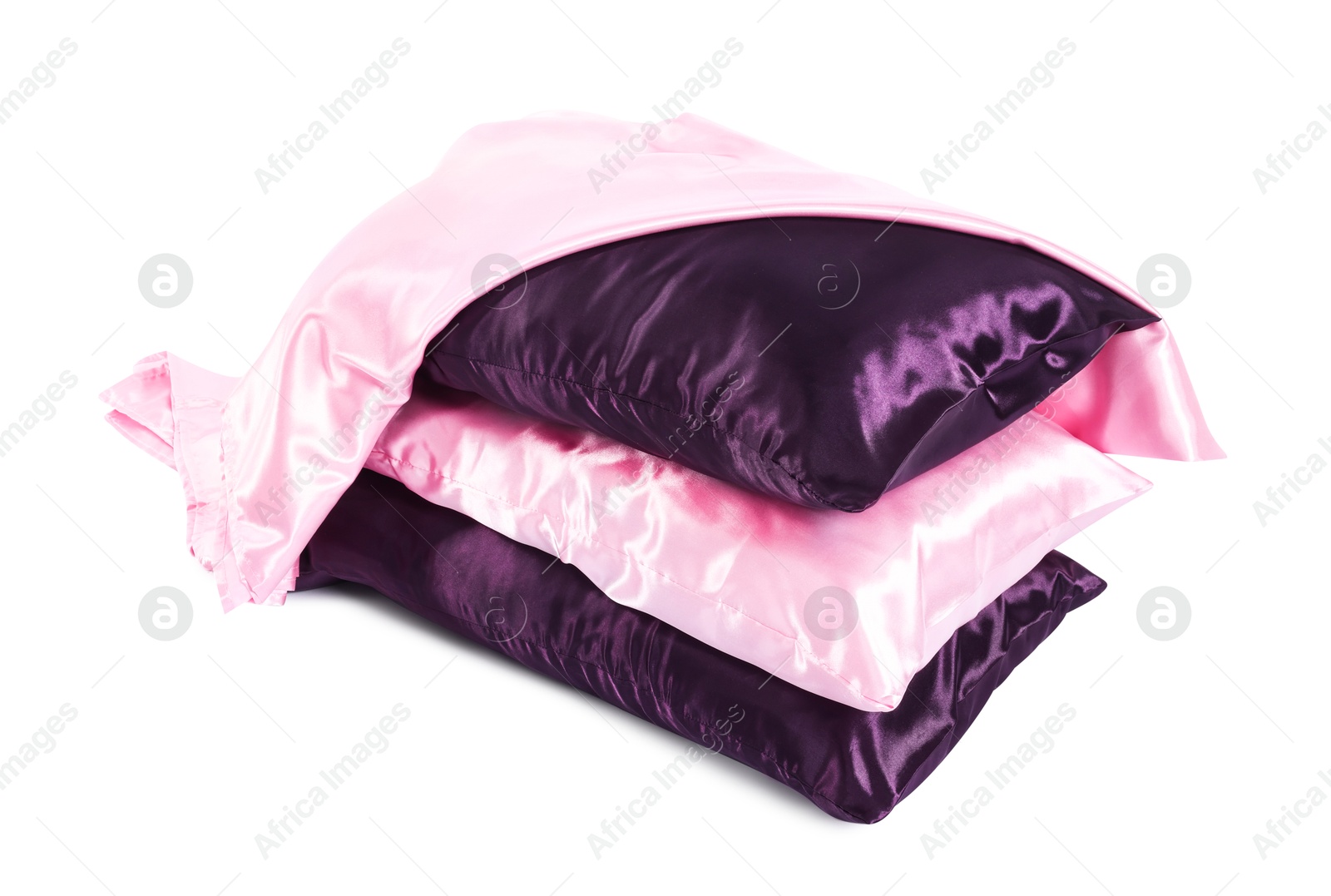 Pillows and silk bed linens isolated on white Photo of Pillows and silk bed linens isolated on white