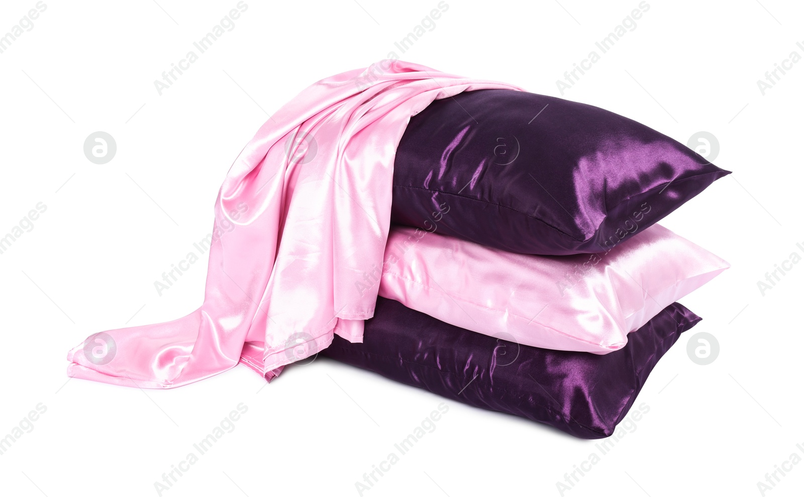 Pillows and silk bed linens isolated on white Photo of Pillows and silk bed linens isolated on white