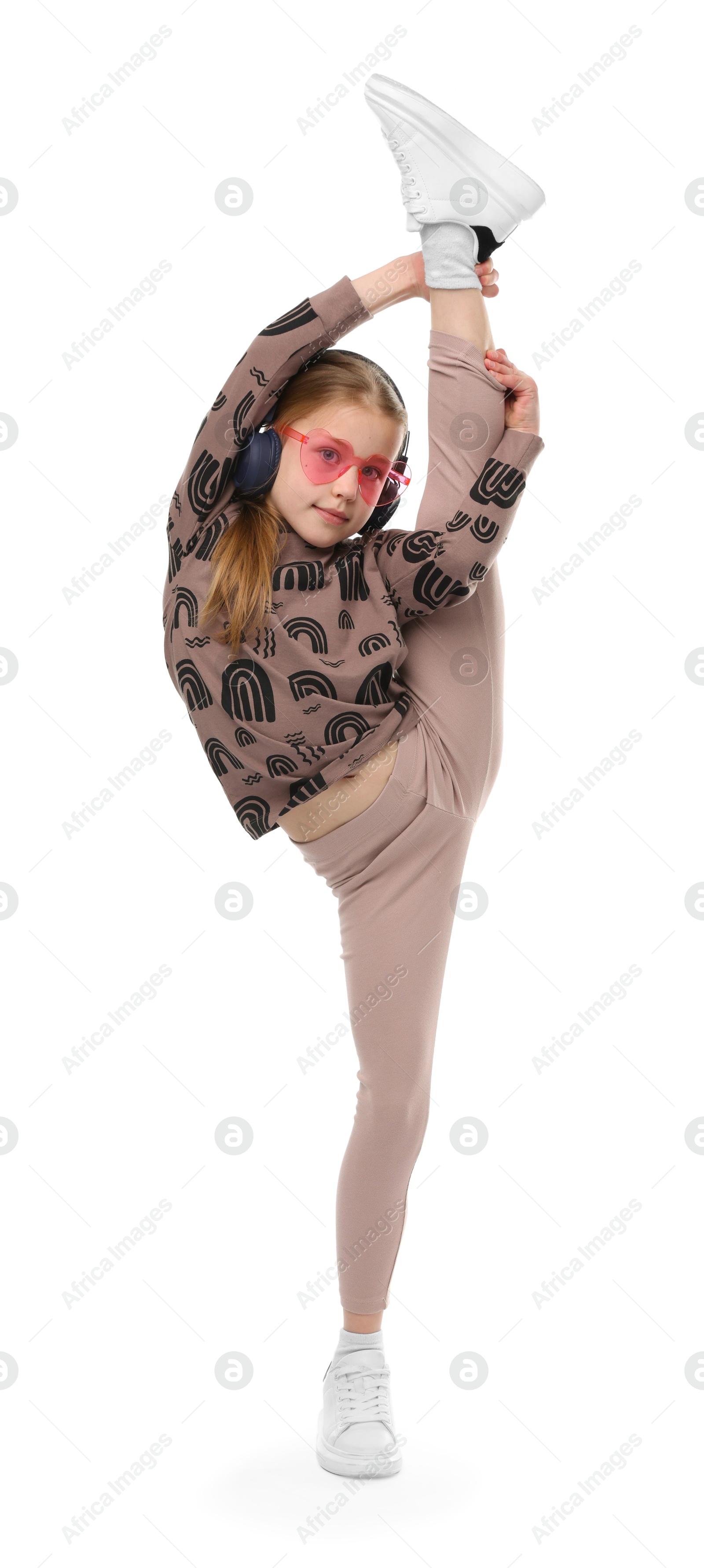 Girl in stylish clothes and sunglasses dancing on white background Photo of Girl in stylish clothes and sunglasses dancing on white background