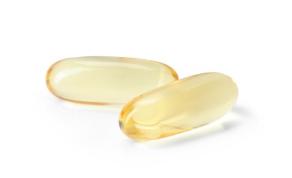 Photo of Collagen capsules isolated on white. Dietary supplement