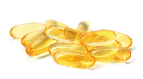 Photo of Collagen capsules isolated on white. Dietary supplement