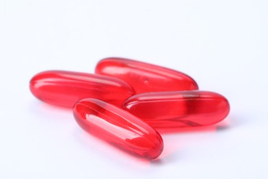 Photo of Collagen capsules isolated on white. Dietary supplement