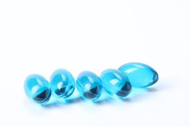 Photo of Collagen capsules isolated on white. Dietary supplement
