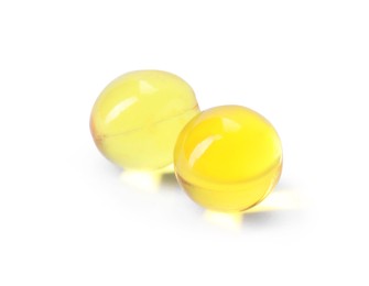Photo of Collagen capsules isolated on white. Dietary supplement