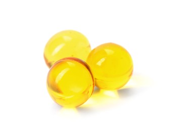 Photo of Collagen capsules isolated on white. Dietary supplement