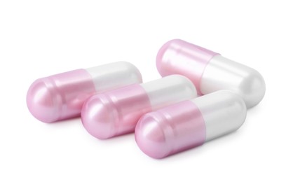 Photo of Collagen capsules isolated on white. Dietary supplement