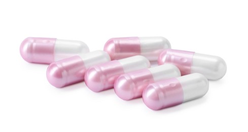 Photo of Collagen capsules isolated on white. Dietary supplement