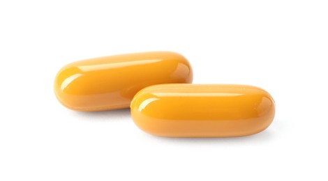 Photo of Collagen capsules isolated on white. Dietary supplement