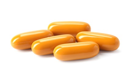 Photo of Collagen capsules isolated on white. Dietary supplement