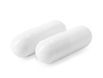 Photo of Collagen capsules isolated on white. Dietary supplement