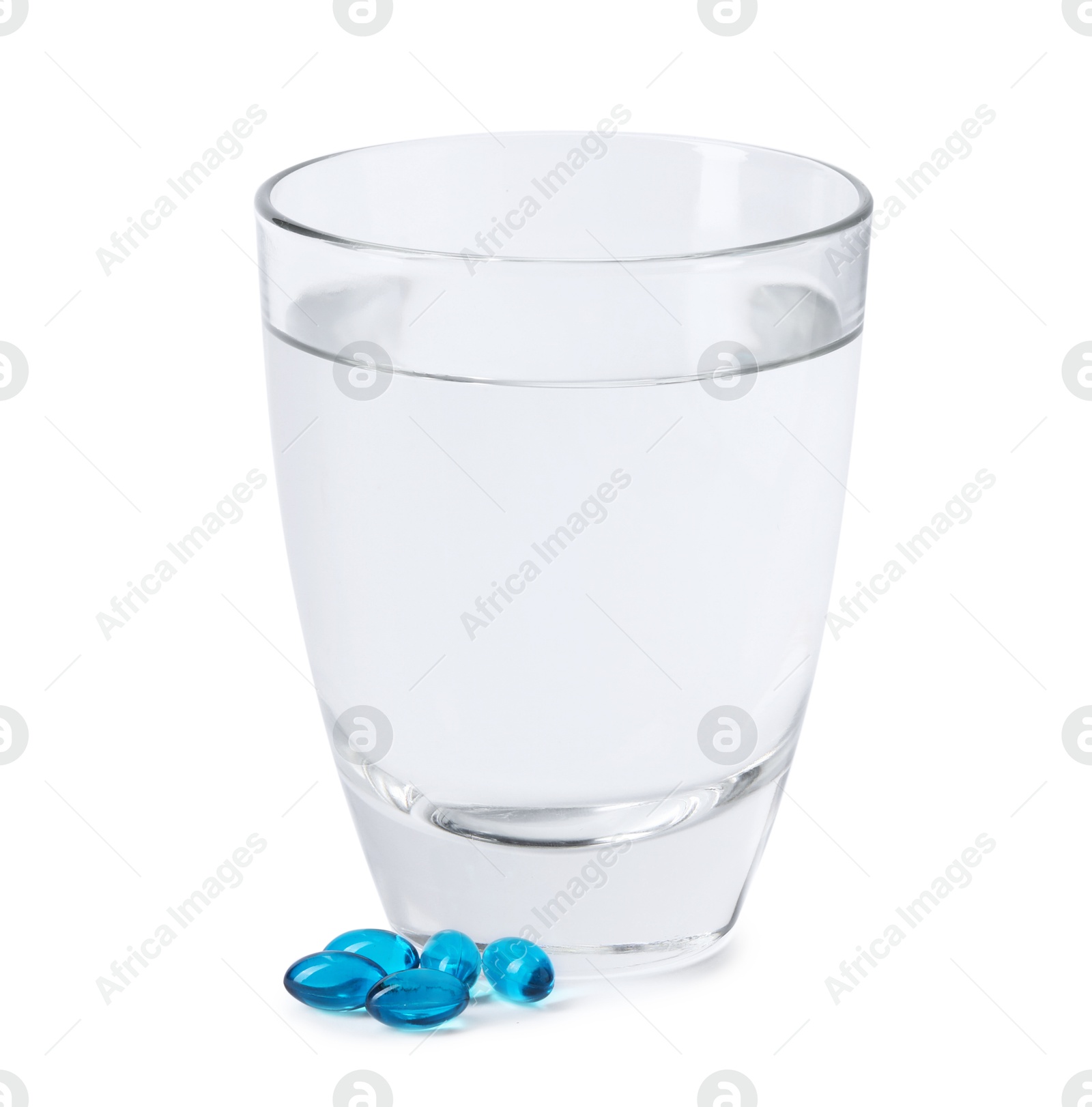 Collagen capsules and glass of water isolated on white Photo of Collagen capsules and glass of water isolated on white