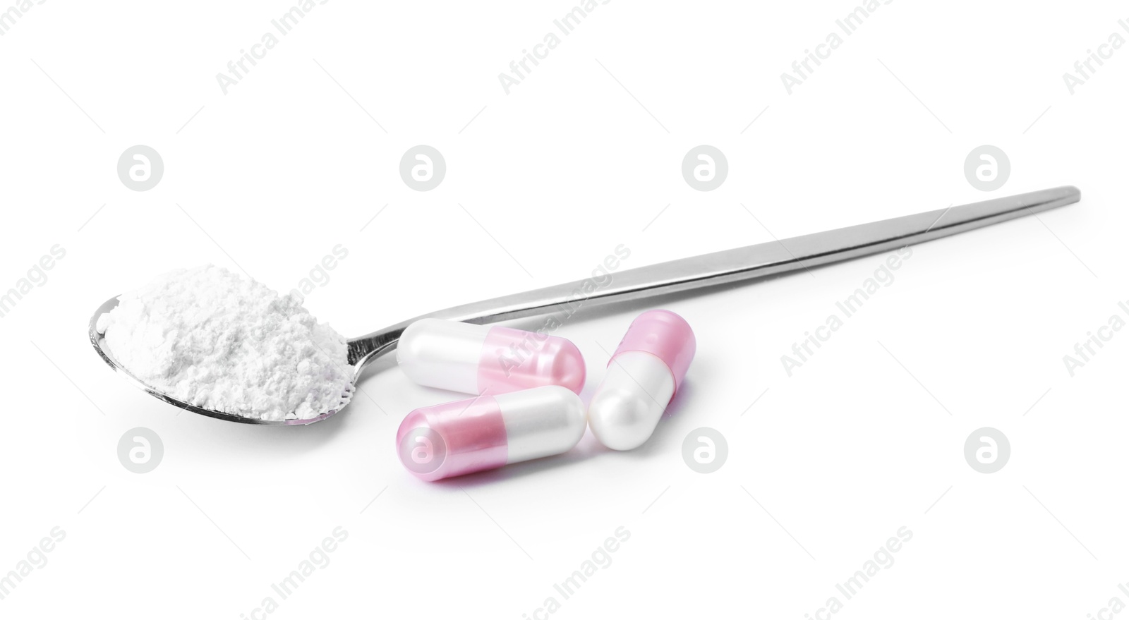 Collagen powder in spoon and pills isolated on white Photo of Collagen powder in spoon and pills isolated on white