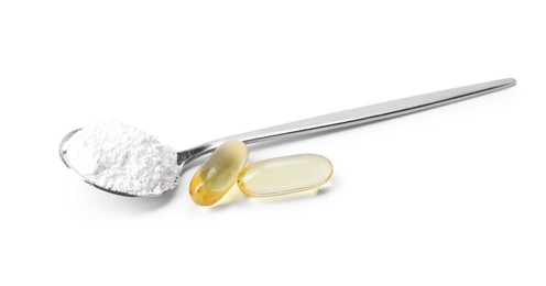 Photo of Collagen powder in spoon and pills isolated on white