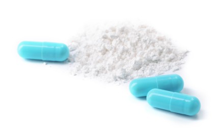 Photo of Collagen powder and pills isolated on white