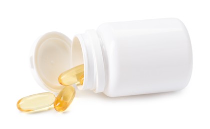 Photo of Collagen capsules in bottle isolated on white