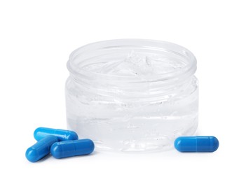 Photo of Jar of collagen gel and pills isolated on white