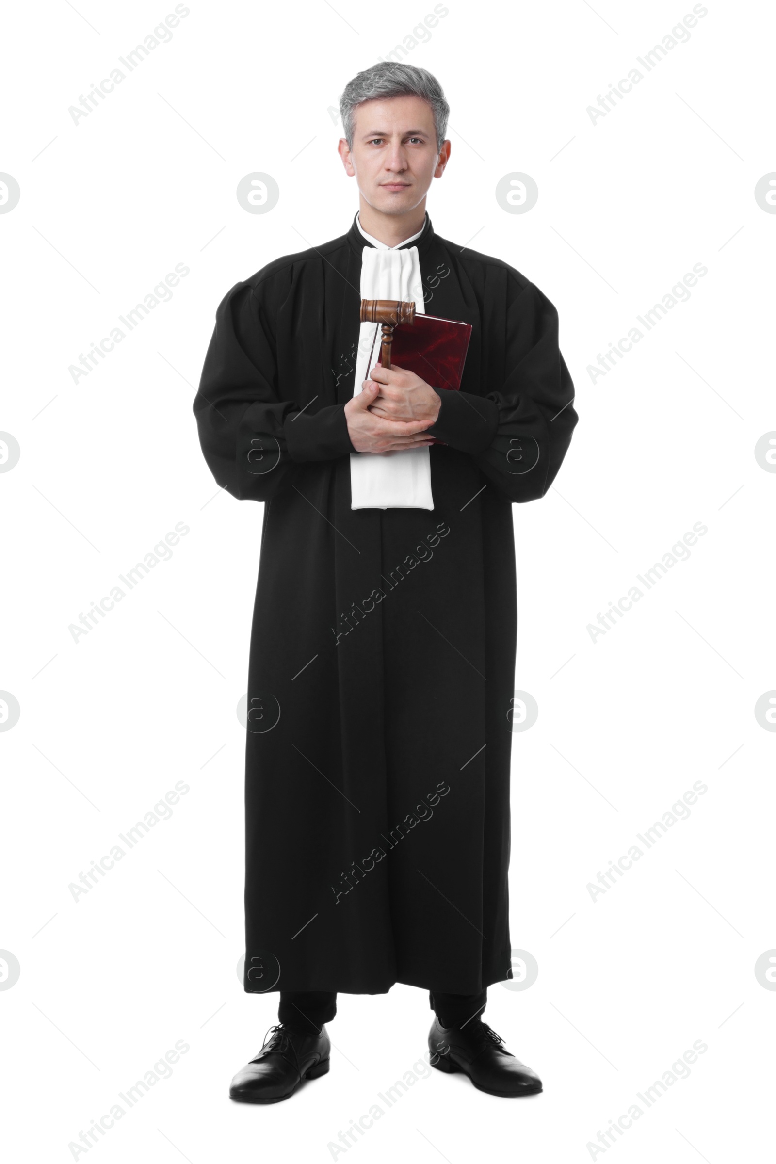 Judge in court dress with mallet and book on white background Photo of Judge in court dress with mallet and book on white background