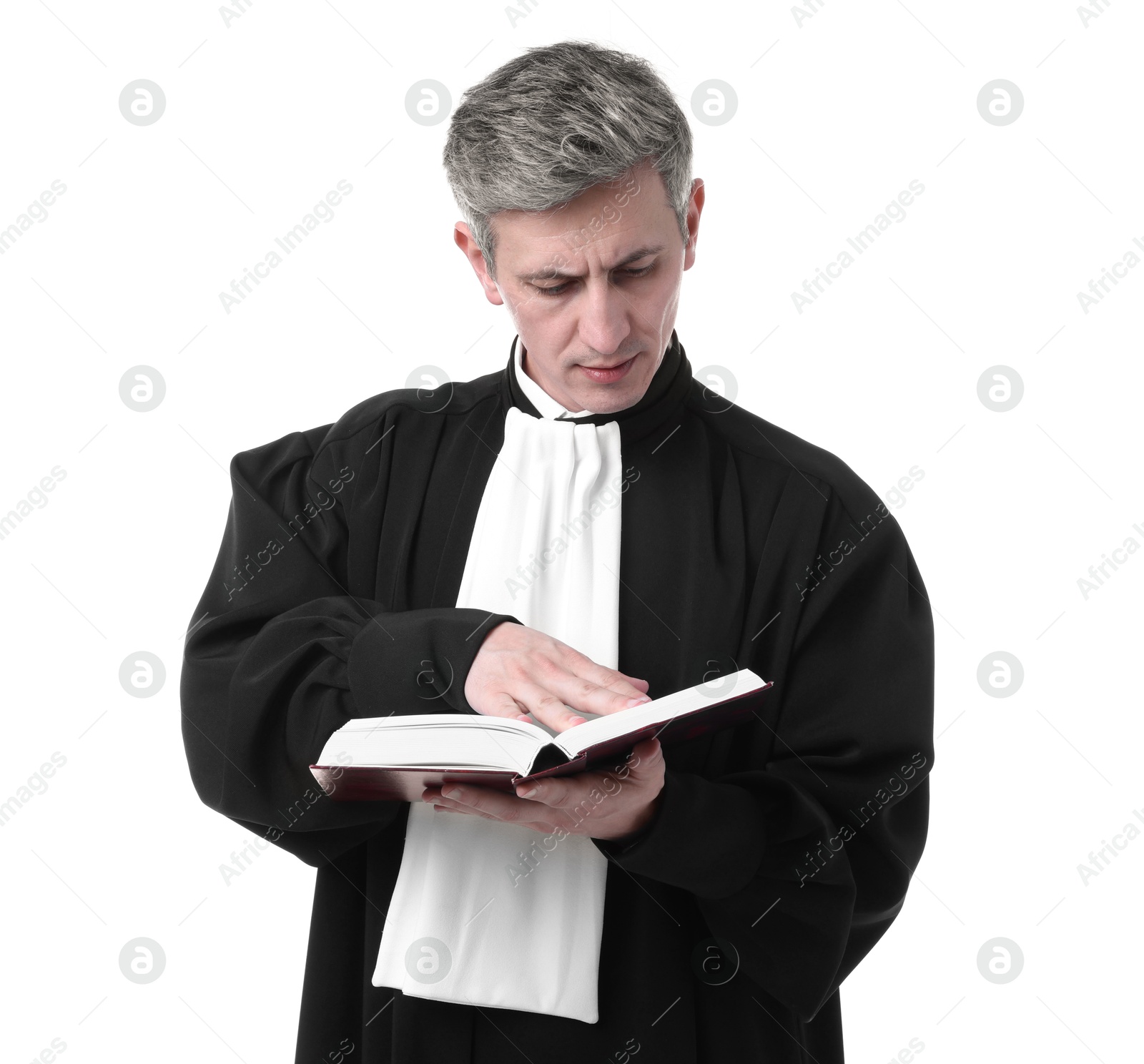 Judge in court dress reading book on white background Photo of Judge in court dress reading book on white background