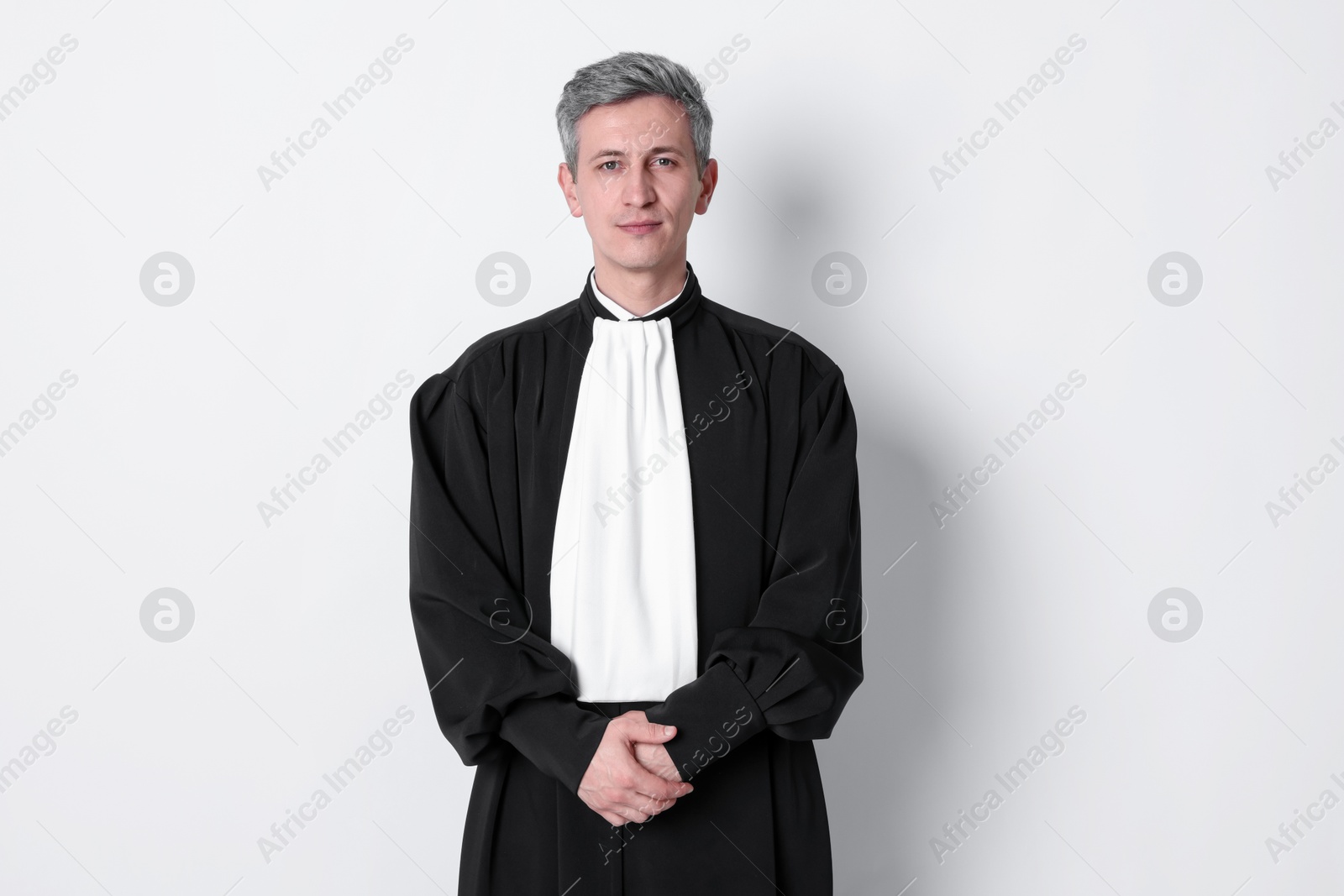 Judge in court dress on light background Photo of Judge in court dress on light background