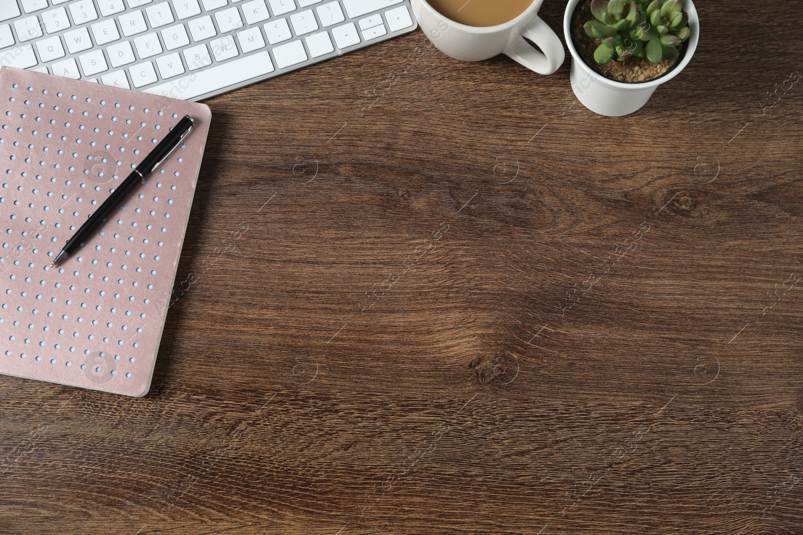 Flat lay composition with office supplies and houseplant on wooden table. Space for text Photo of Flat lay composition with office supplies and houseplant on wooden table. Space for text