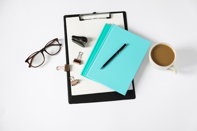 Photo of Flat lay composition with office supplies and cup of coffee on white table