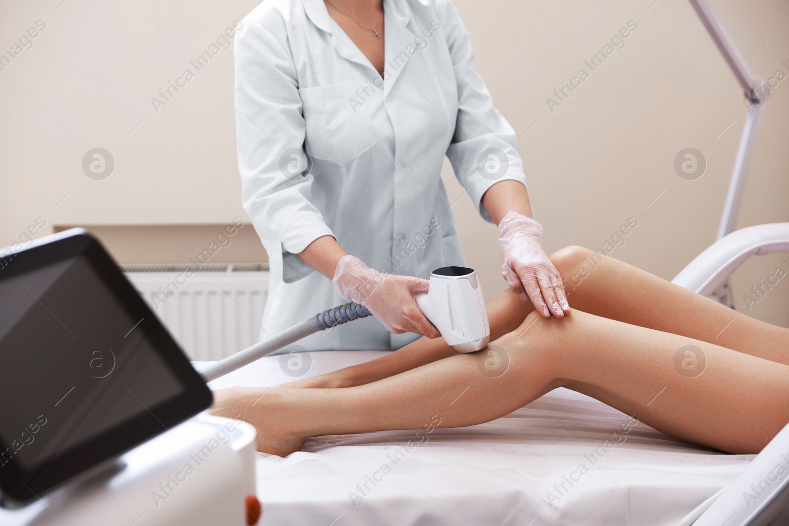 Woman during laser depilation procedure in beauty salon, closeup Photo of Woman during laser depilation procedure in beauty salon, closeup
