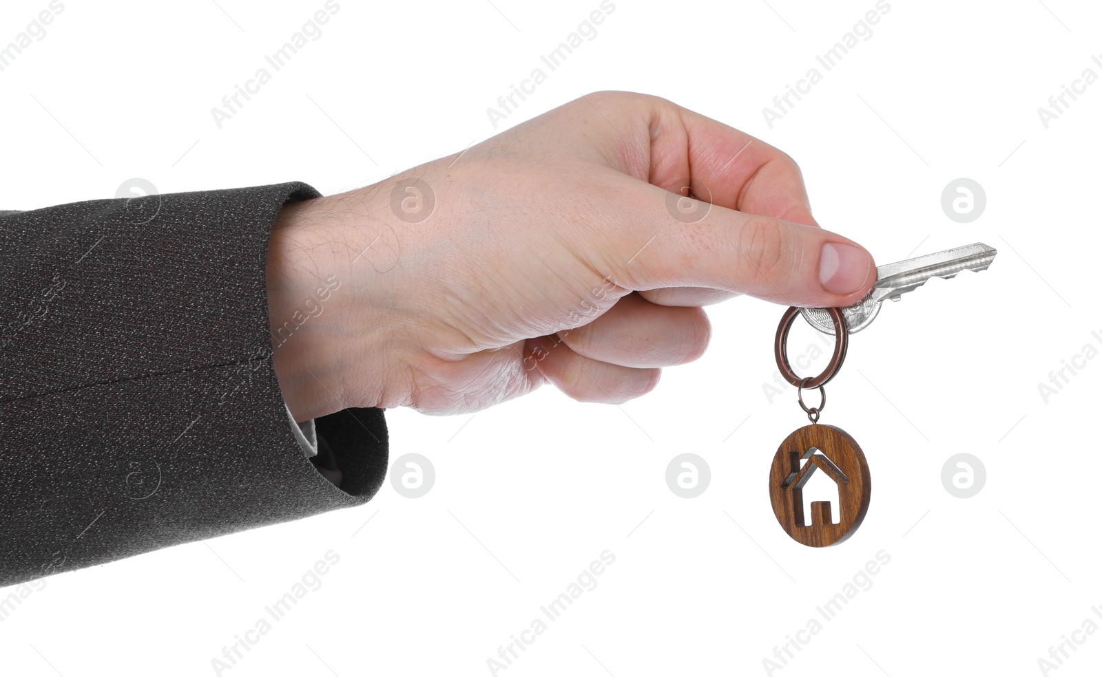 Real estate agent holding key with house shaped keychain on white background, closeup Photo of Real estate agent holding key with house shaped keychain on white background, closeup