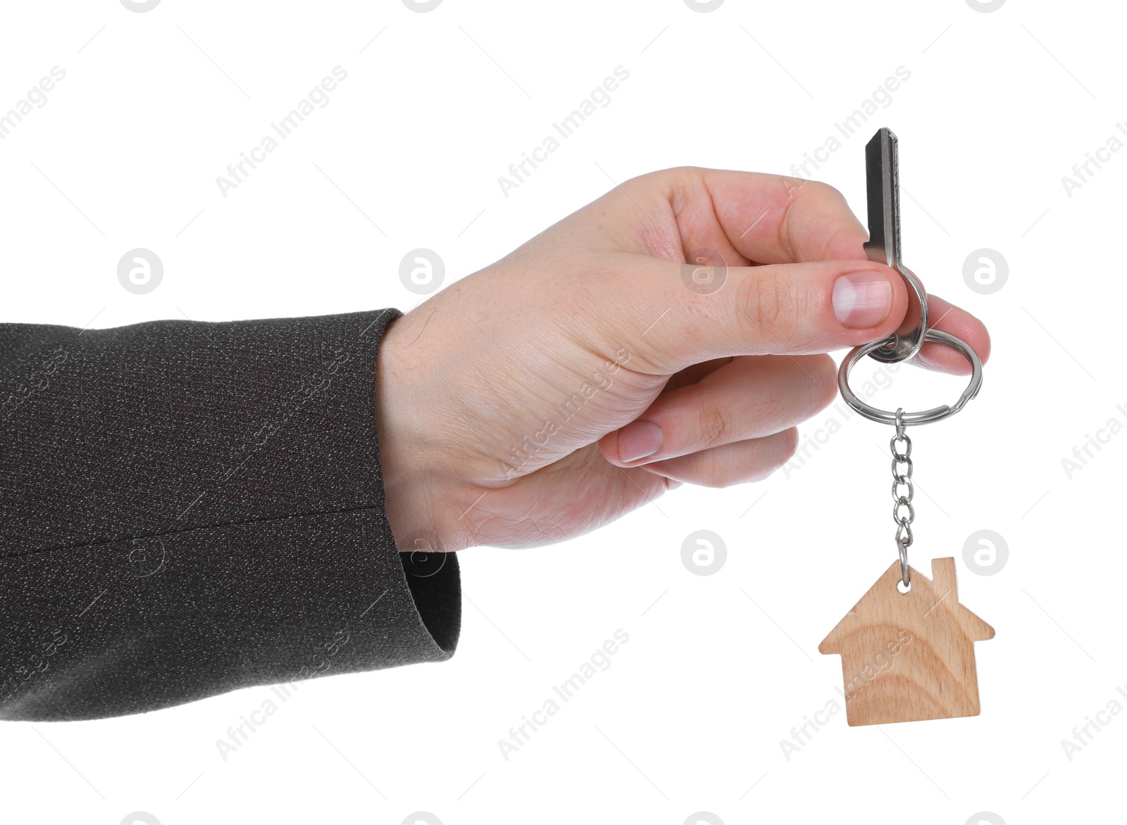 Real estate agent holding key with house shaped keychain on white background, closeup Photo of Real estate agent holding key with house shaped keychain on white background, closeup
