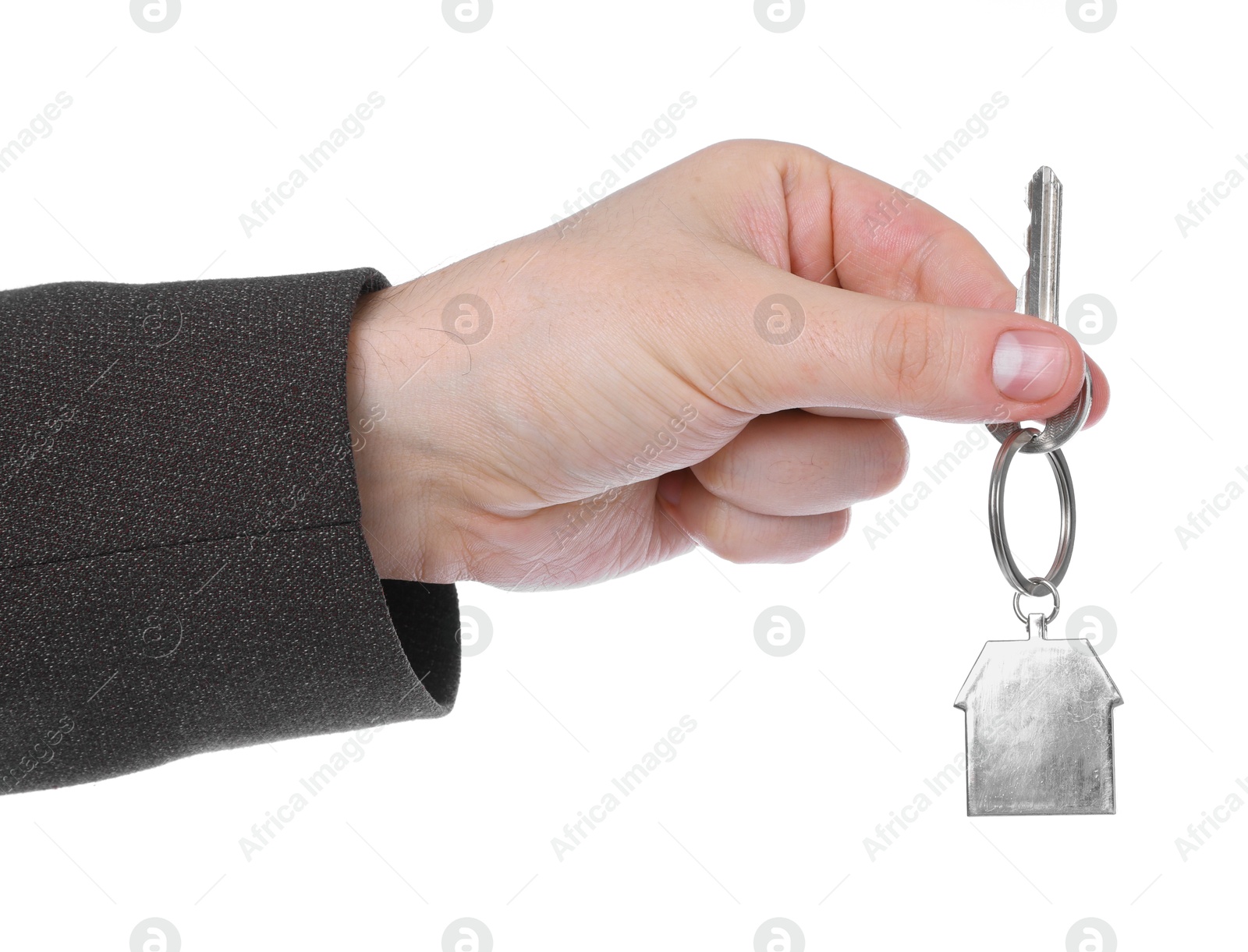 Real estate agent holding key with house shaped keychain on white background, closeup Photo of Real estate agent holding key with house shaped keychain on white background, closeup
