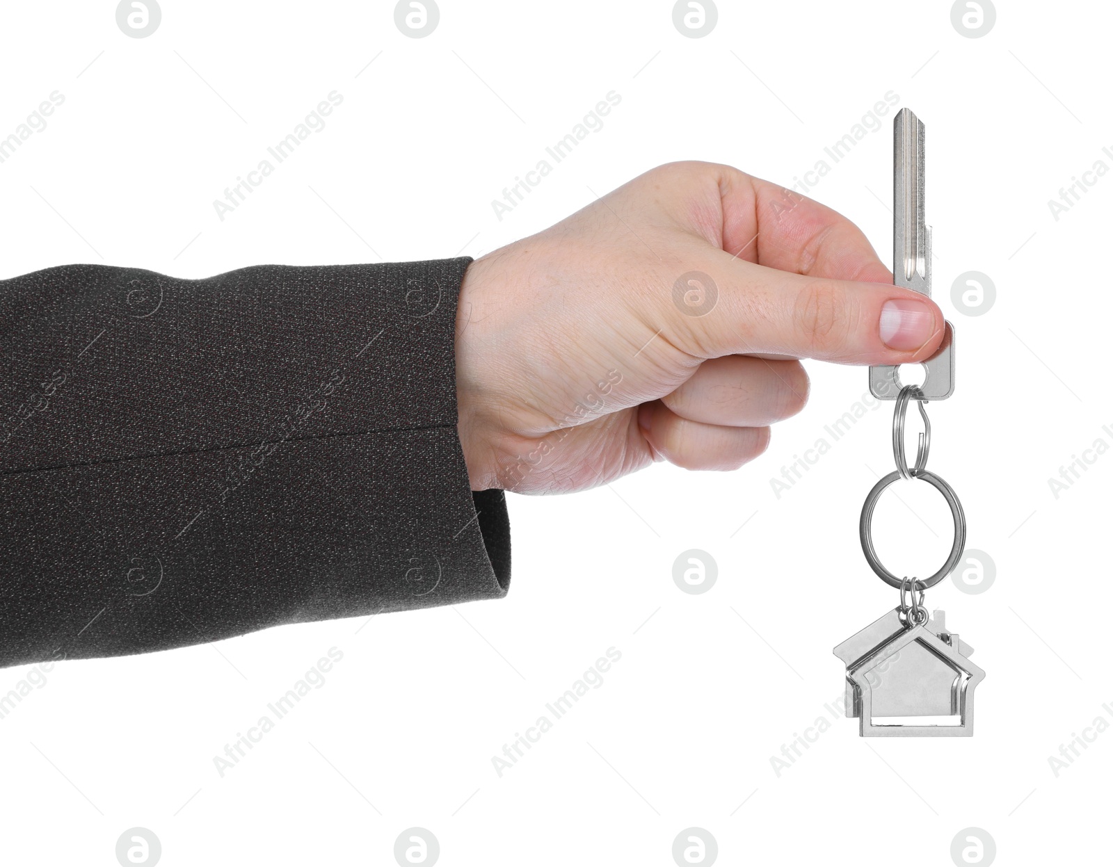 Real estate agent holding key with house shaped keychain on white background, closeup Photo of Real estate agent holding key with house shaped keychain on white background, closeup
