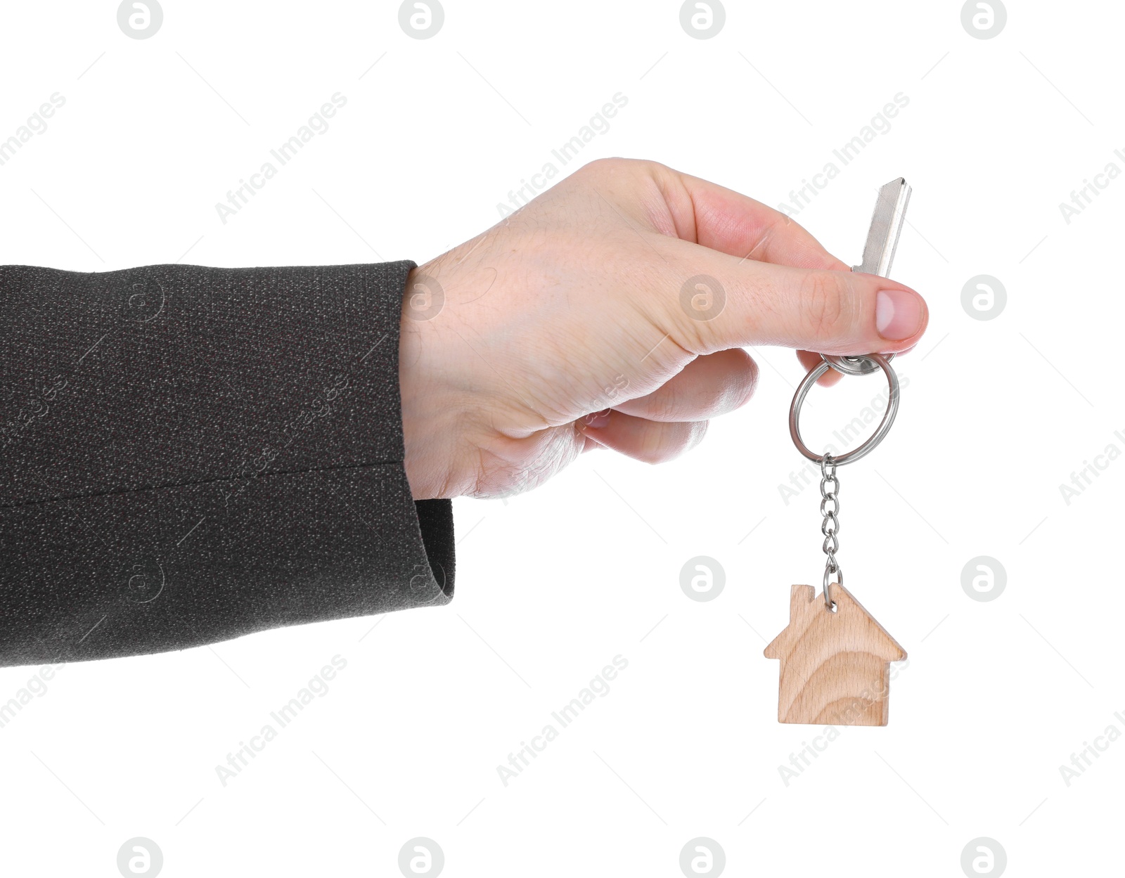 Real estate agent holding key with house shaped keychain on white background, closeup Photo of Real estate agent holding key with house shaped keychain on white background, closeup