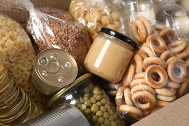 Photo of Different food products in box as background, closeup