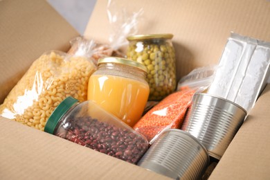 Photo of Many different food products in box, closeup