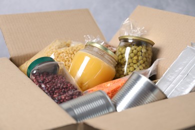 Photo of Many different food products in box, closeup