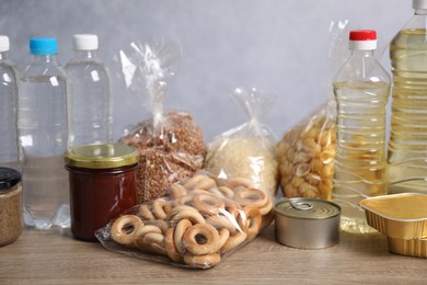 Photo of Many different food products on wooden table, closeup