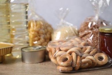 Photo of Many different food products on wooden table, closeup