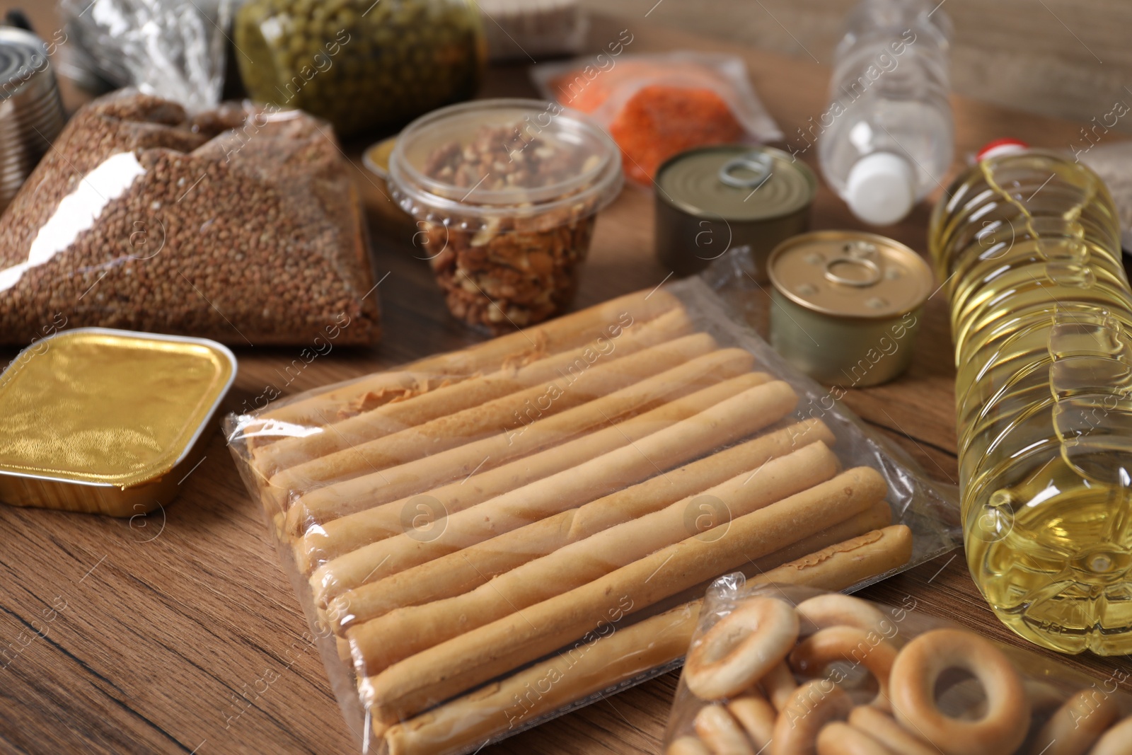 Different food products on wooden table, closeup Photo of Different food products on wooden table, closeup