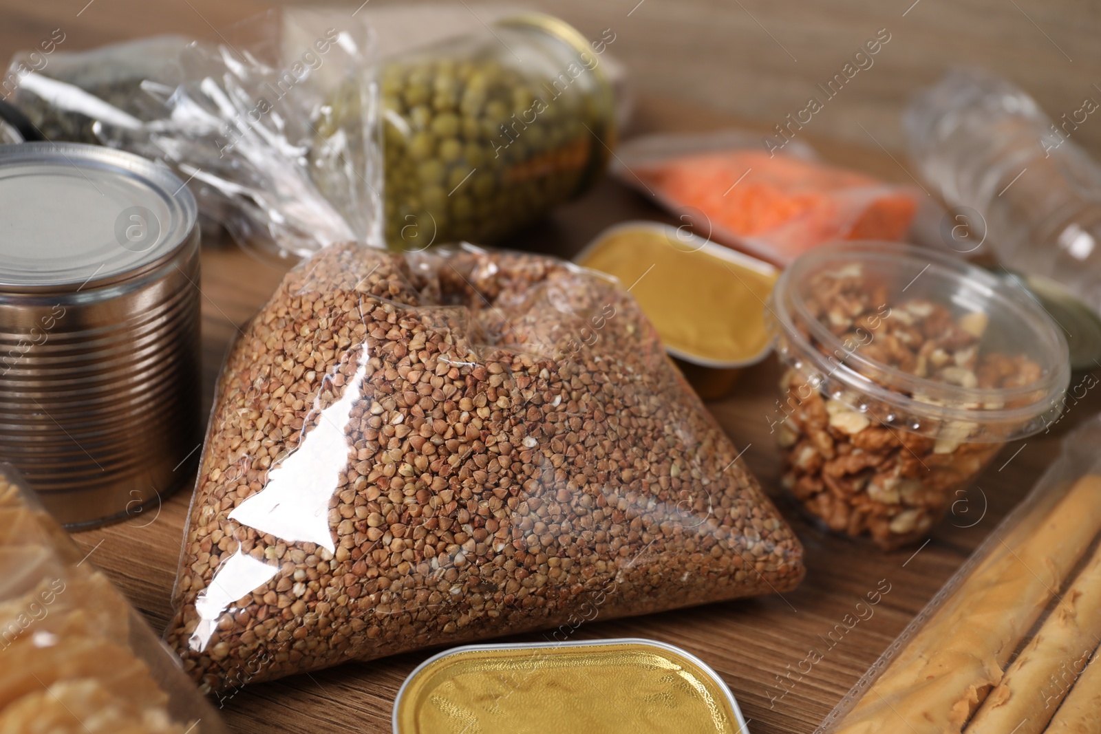 Different food products on wooden table, closeup Photo of Different food products on wooden table, closeup