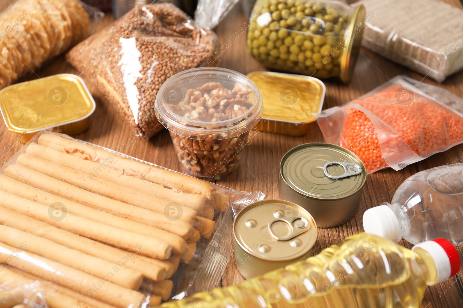Different food products on wooden table, closeup Photo of Different food products on wooden table, closeup