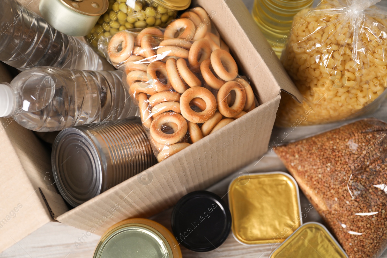 Different food products and box on table, top view Photo of Different food products and box on table, top view