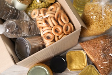 Photo of Different food products and box on table, top view