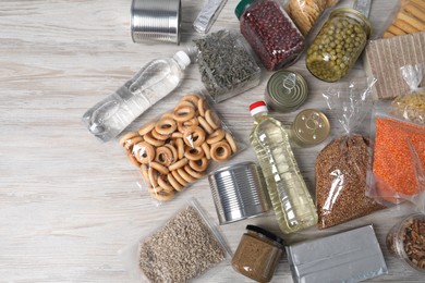Photo of Different food products on wooden table, flat lay