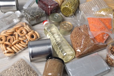 Photo of Different food products on wooden table, closeup