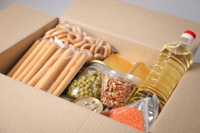 Photo of Many different food products in box, closeup