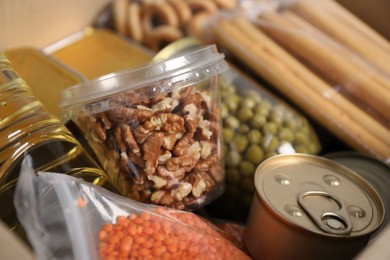 Photo of Many different food products in box, closeup