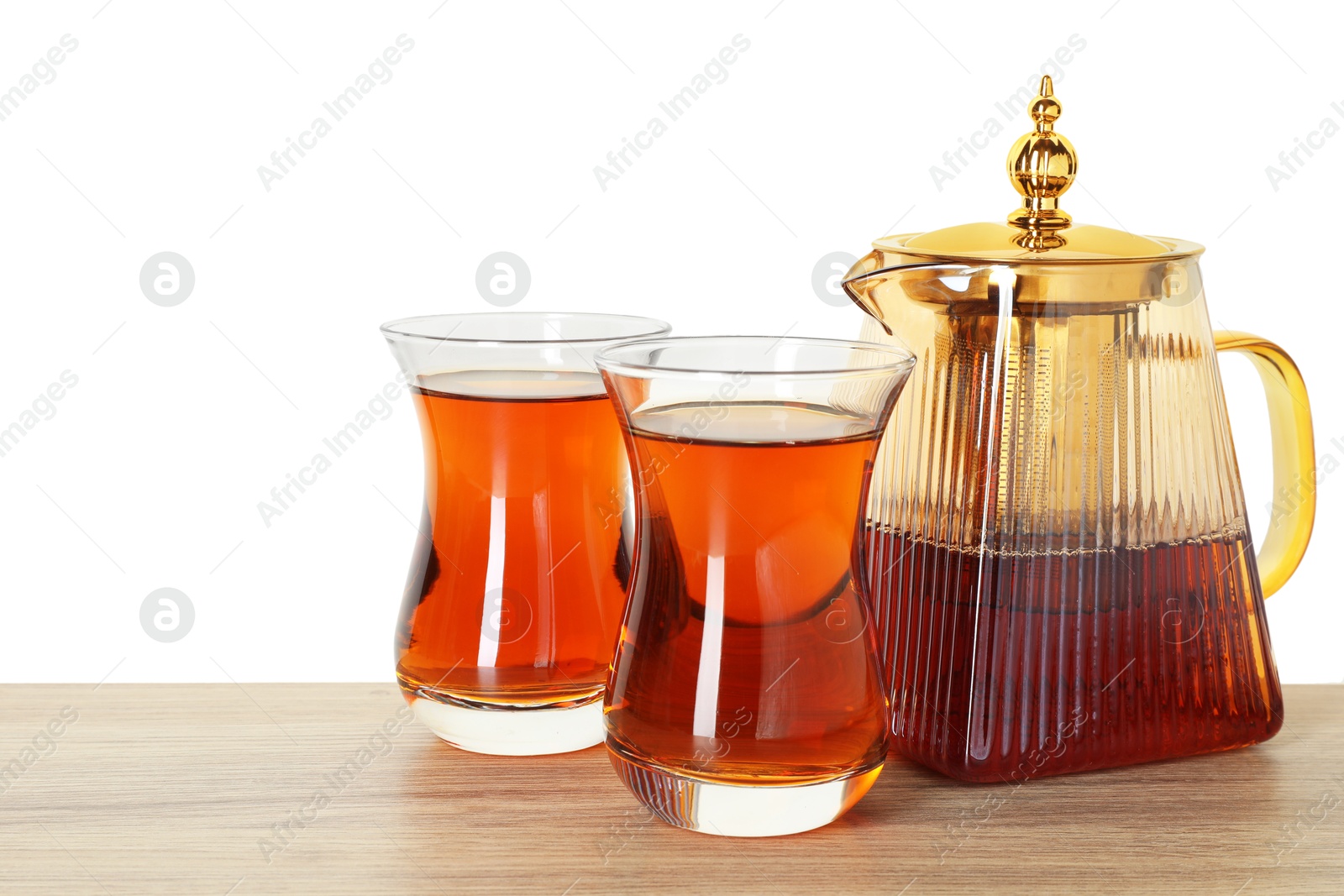 Tasty Turkish tea in cups and teapot on wooden table against white background Photo of Tasty Turkish tea in cups and teapot on wooden table against white background