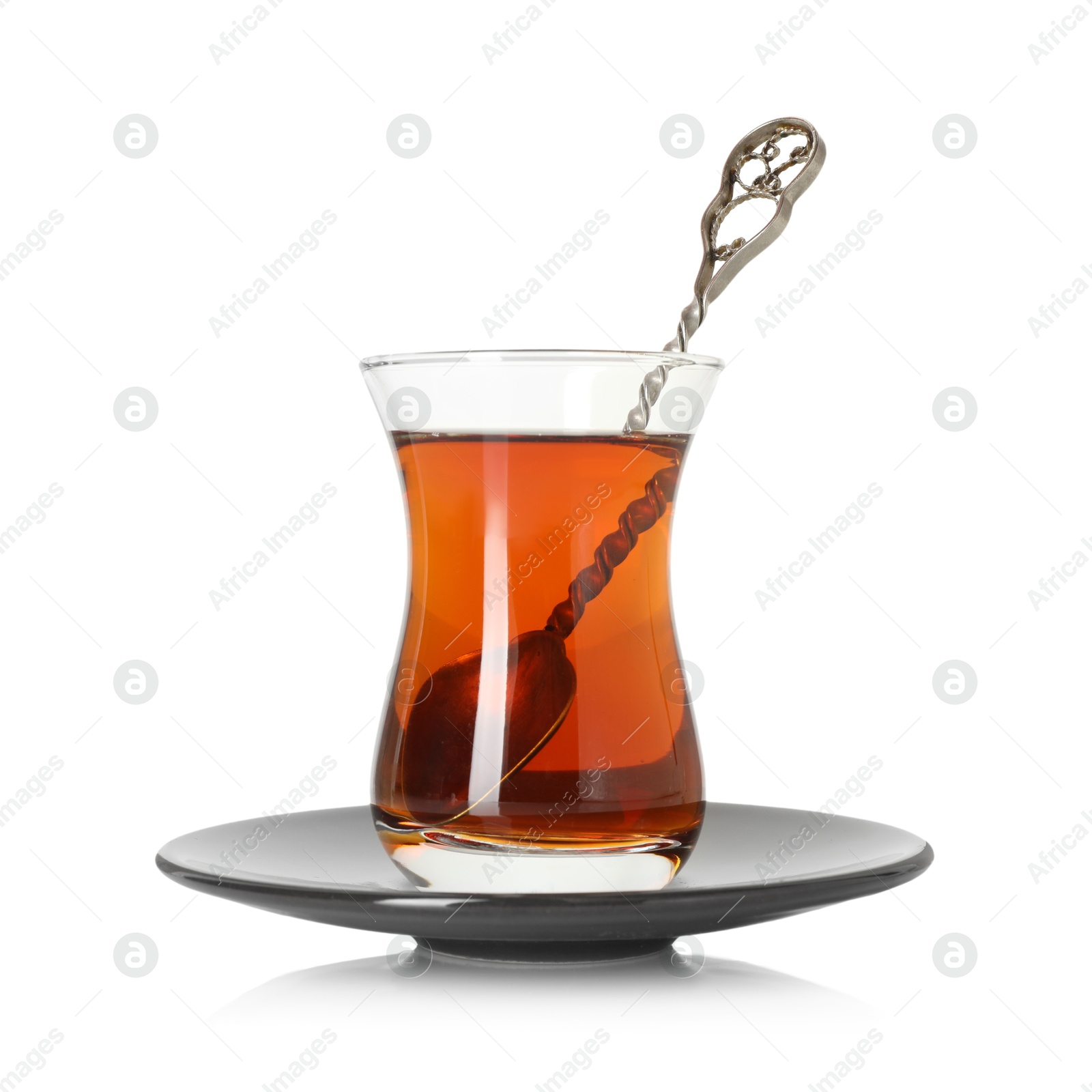 Tasty Turkish tea in glass cup isolated on white Photo of Tasty Turkish tea in glass cup isolated on white